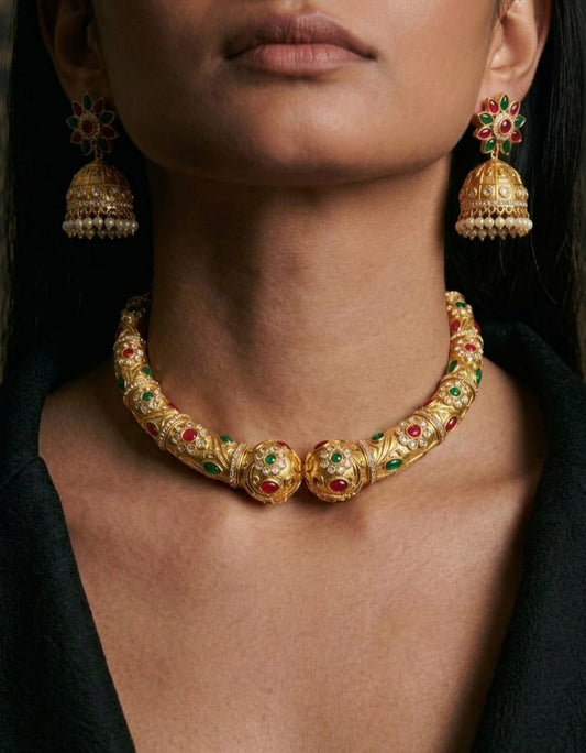 Rajmahal antique gold hasli necklace set with ruby emerald stones and matching jhumka earrings
