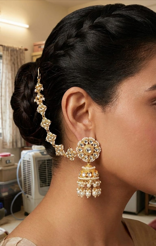 Champakali white kundan jhumka earring with kaan chain worn along hairline
