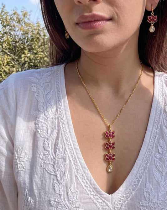 Kamalika ruby lotus pendant necklace on gold chain worn on neckline