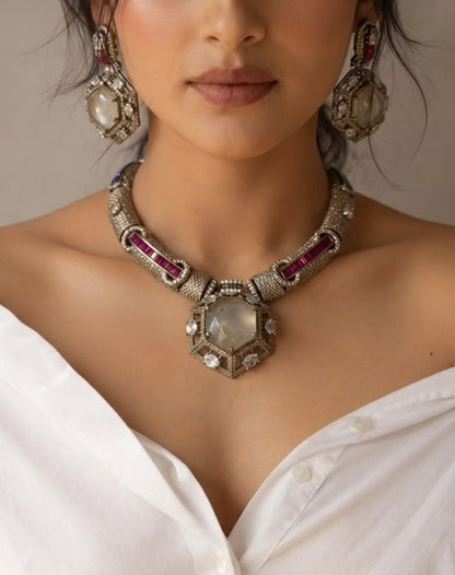 Antique silver statement necklace set with ruby emerald stones.