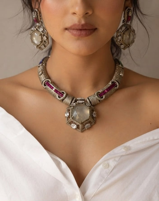 Antique silver statement necklace set with ruby emerald stones.